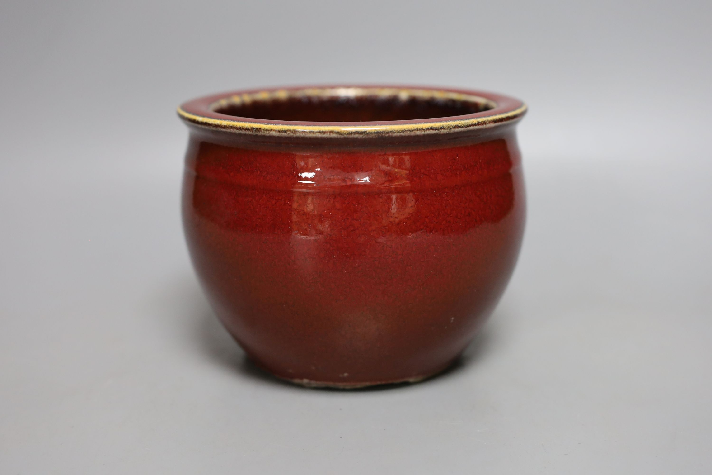 A Chinese sang de boeuf glazed jardiniere - 11cm tall